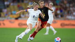Leah Williamson of England battles with Marie Minnaert of Belgium in a friendly prior to the UEFA Women's Euro 2022 tournament 