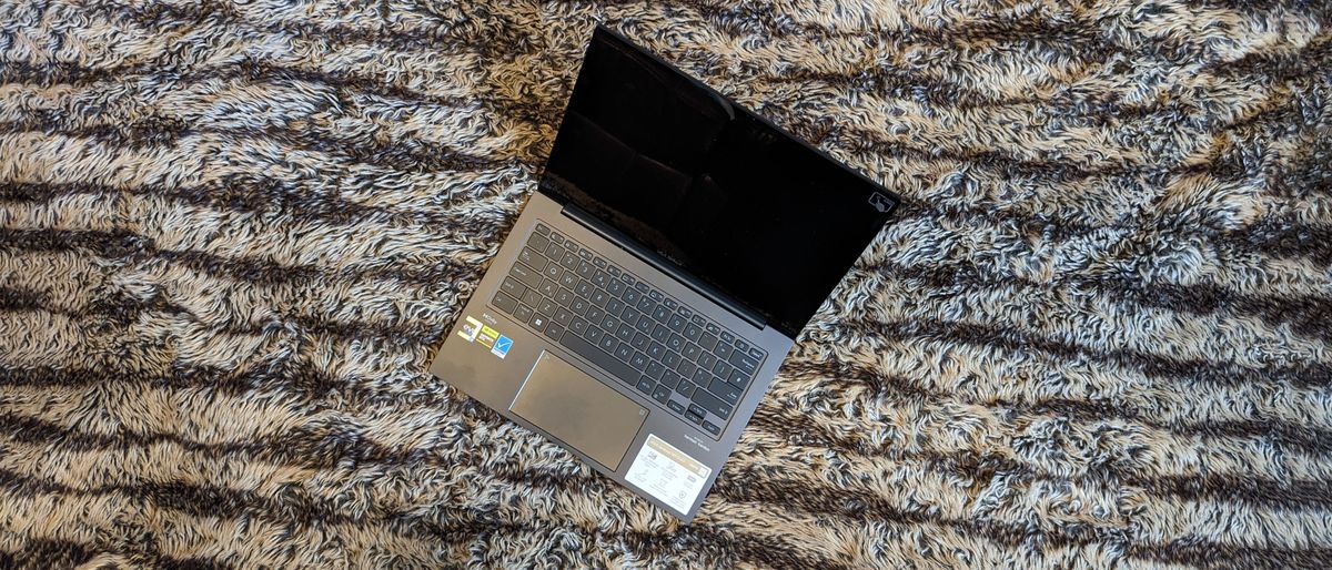 Asus Zenbook 14X OLED laptop on carpet