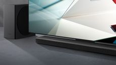 Samsung soundbar and TV on grey surface