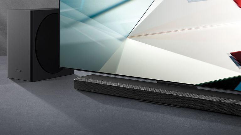 Best soundbars for Samsung TVs 2022, image shows a Samsung soundbar and subwoofer next to a Samsung TV