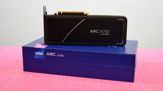 An Intel Arc A750 graphics card on top of its retail packaging