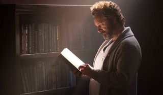 Michael Sheen reading a book from jail.