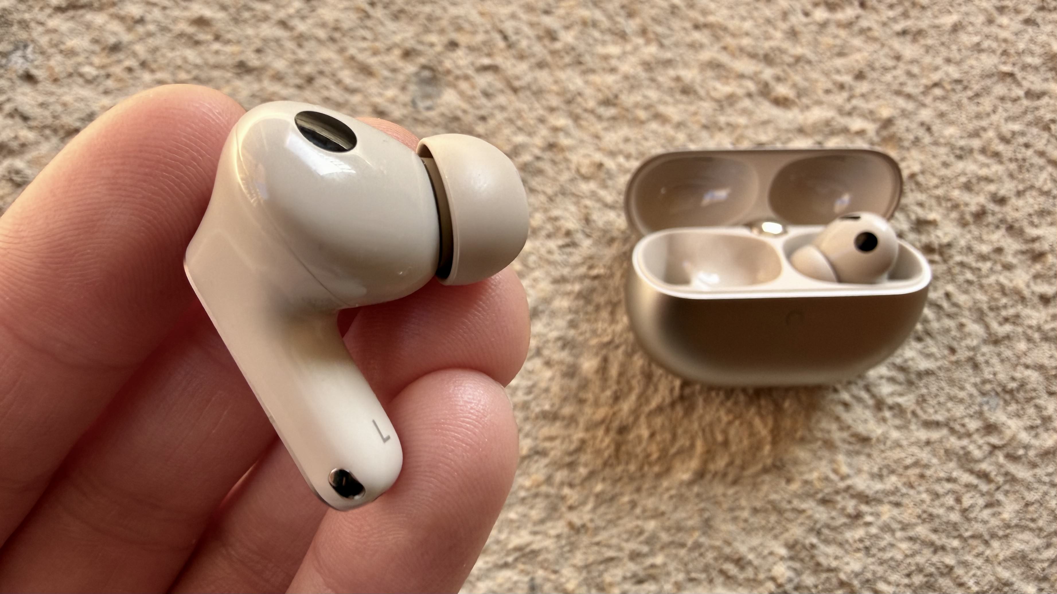 Someone holding one of the huawei freebuds pro 5 buds close to the camera