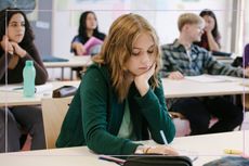 Sad teenage girl in the classroom