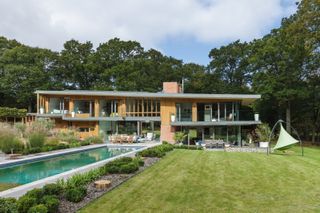 natural swimming pool in front of large contemporary self build