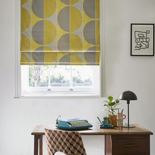 margo selby yellow blind home office with wood desk