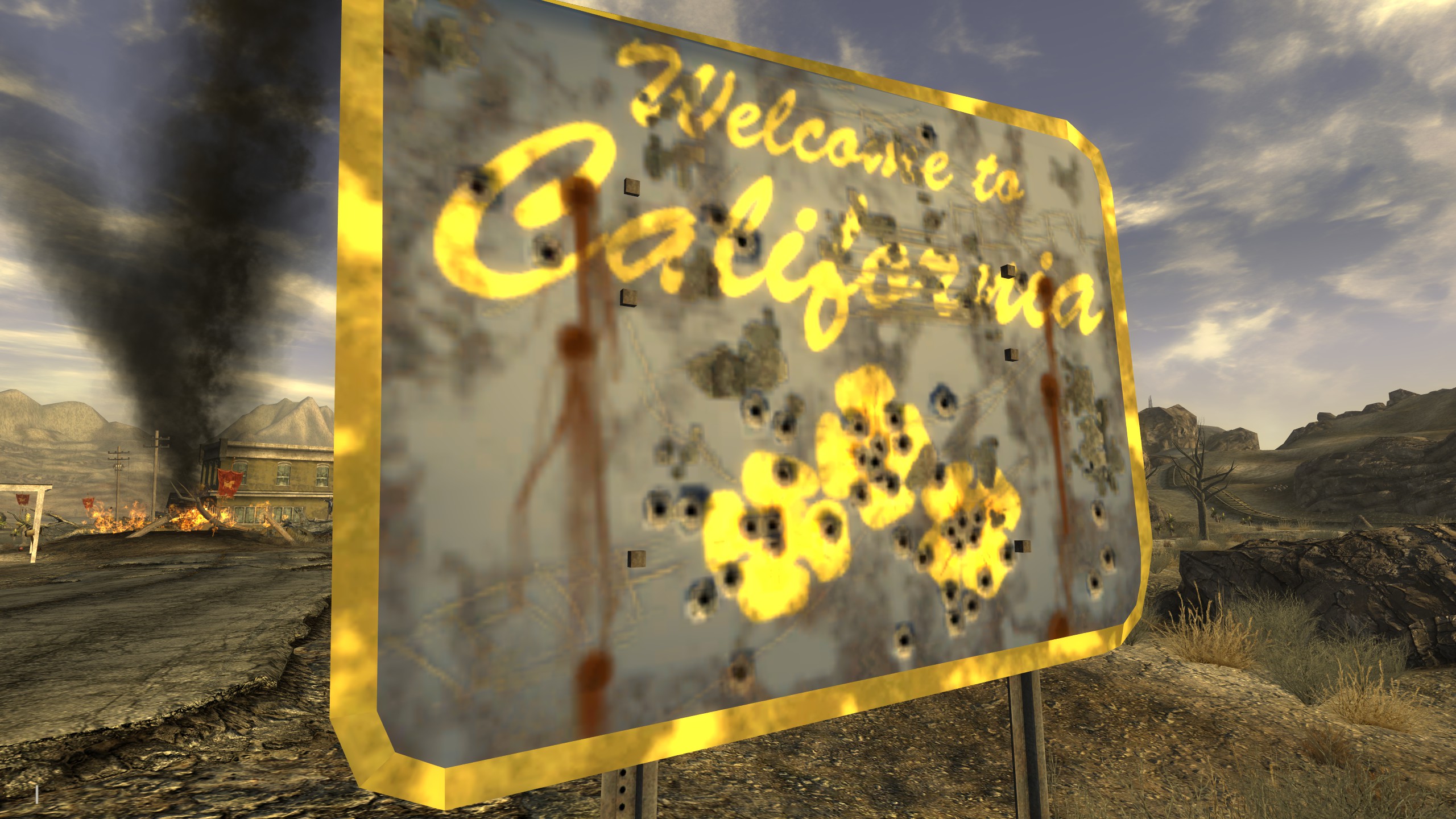 A bullet-ridden sign says Welcome to California