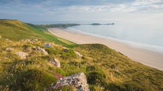 Rhossili Bay, with Worms Head promontory, on the Gower Peninsula, Wales
