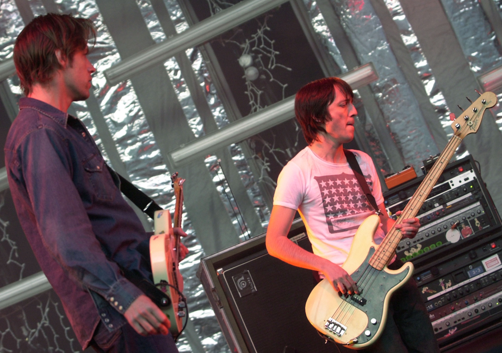 Ed O&#039;Brien (left) and Colin Greenwood perform onstage with Radiohead at the Santa Barbara Bowl in California on June 29, 2001