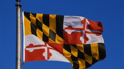 Maryland State flag flying in the sky for Maryland state tax guide
