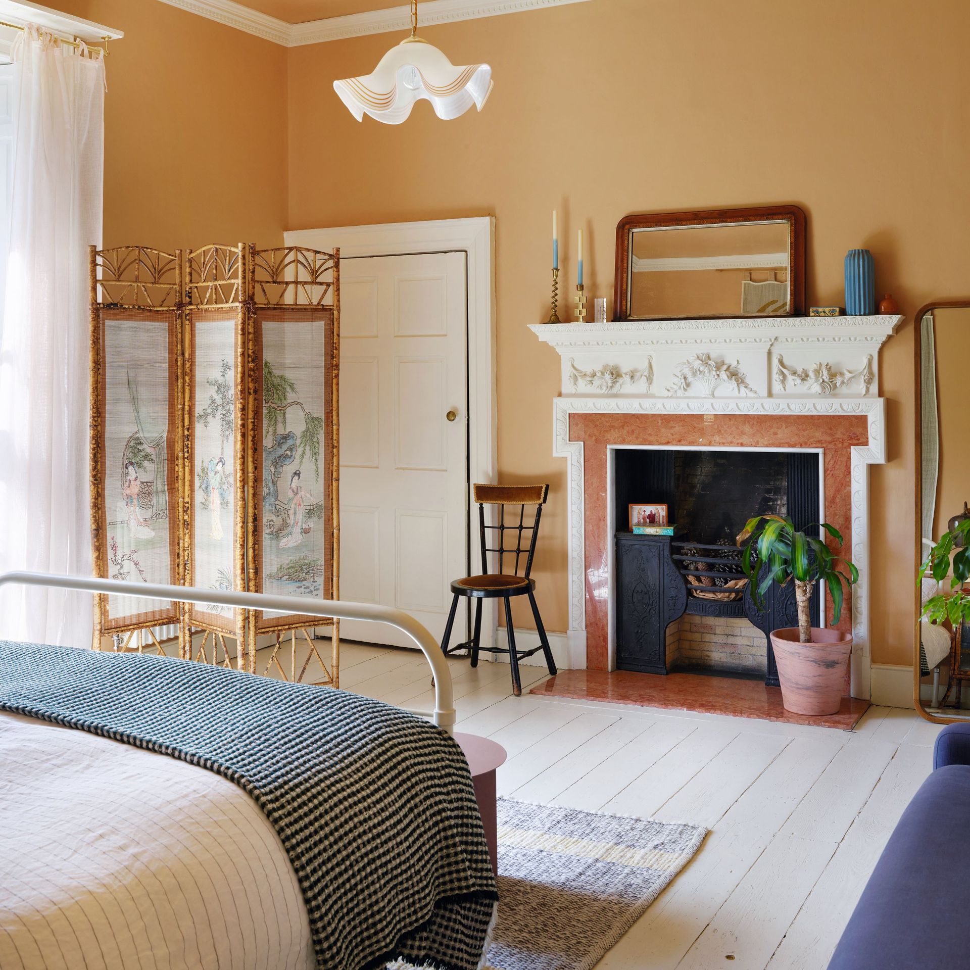 Correct this rug sizing mistake for a luxe-looking bedroom Correct this rug sizing mistake for a luxe-looking bedroom