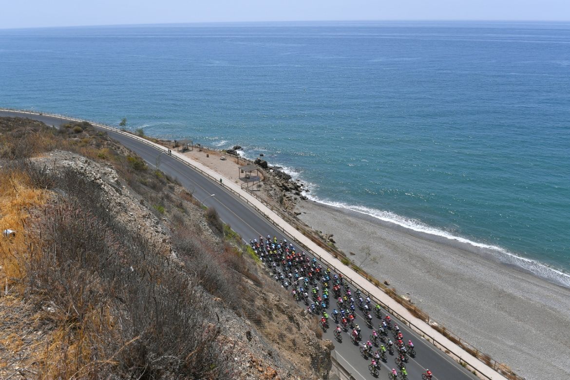 The peloton makes its way along the south coast