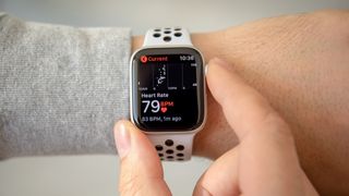 a photo of an apple watch showing heart rate 