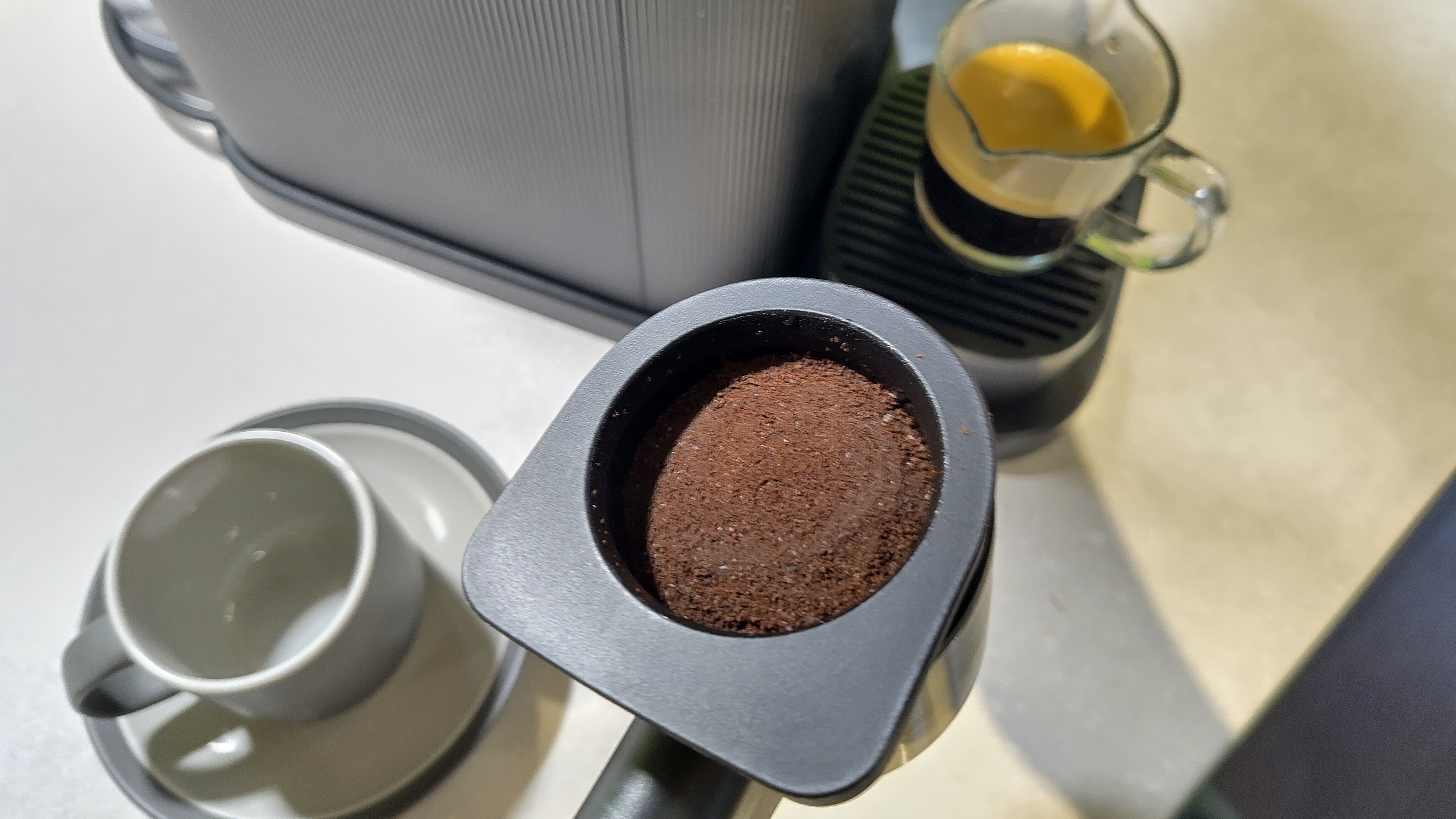 Philips Baristina espresso machine portafilter with used coffee grounds