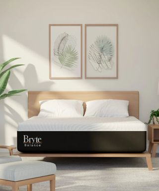 Bryte Balance Mattress on a wood bed frame against white walls. 