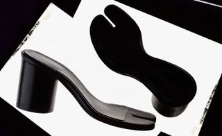 a pair of black heels with no upper part