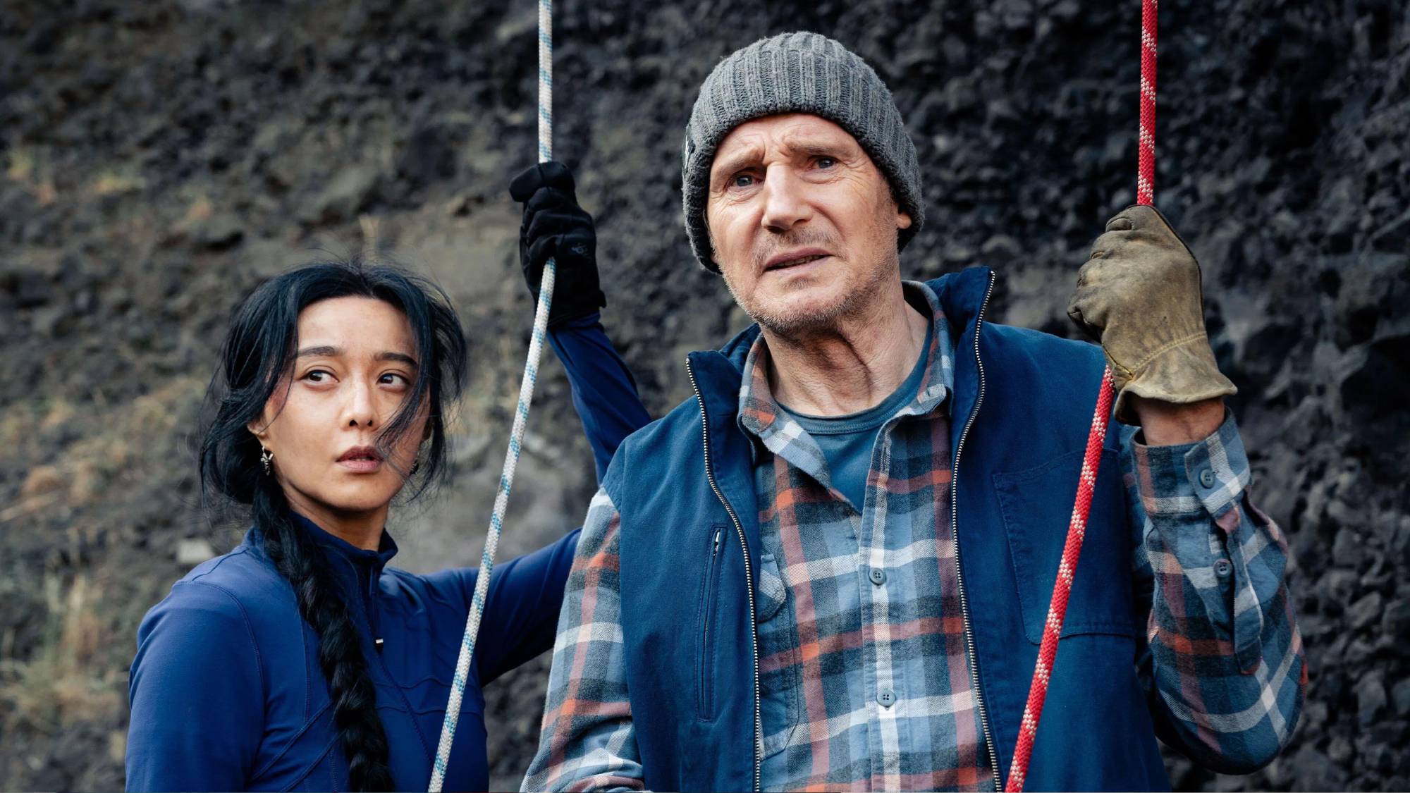 (L-R) Fan Bingbing as Dhani Yangchen and Liam Neeson as Mike McCann in &quot;Ice Road: Vengeance&quot;