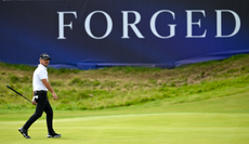 Brian Harman walks off the green