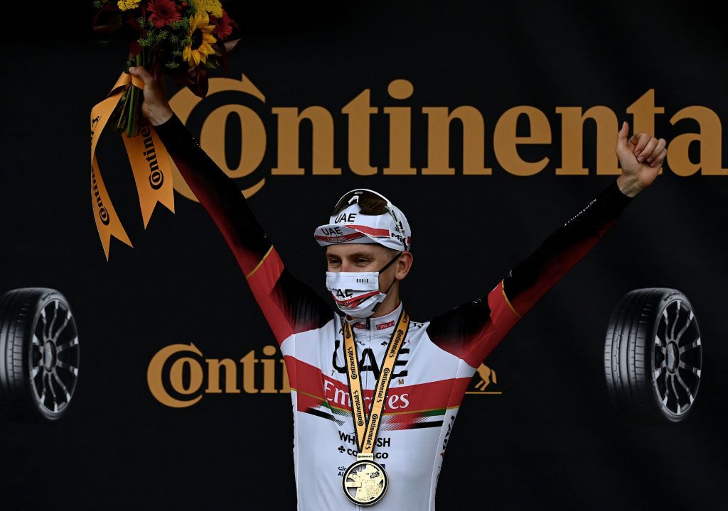 Stage winner Team UAE Emirates Tadej Pogacar of Slovenia celebrates on the podium after winning the 5th stage of the 108th edition of the Tour de France cycling race a 27 km time trial between Change and Laval on June 30 2021 Photo by Philippe LOPEZ AFP Photo by PHILIPPE LOPEZAFP via Getty Images
