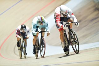 Picture by Will Palmer/SWpix.com - 27/11/2021 - Cycling - UCI Track Champions League Round 2 - Lithuania / Cido Arena, PanevÄ—Å¾ys, Lithuania - Poland's Mateusz Rudyk is chased down by the Netherland's Harrie Lavreysen during the men's sprint first round.