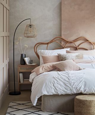 Pink bedroom idea with concrete effect paint and lampshade
