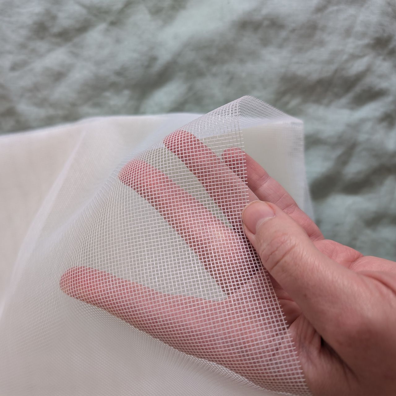 A DIY mosquito screen made with Velcro tape and fly mesh cut to size