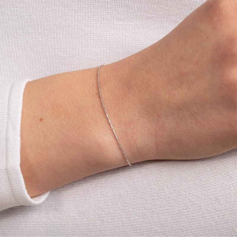 the Astrid &amp;amp; Miyu white gold chain bracelet victoria beckham wear in the trailer for her upcoming netflix documentary 