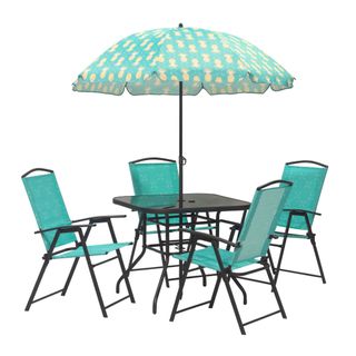 Blue and black patio set with four chairs, a table, and an umbrella with pineapples
