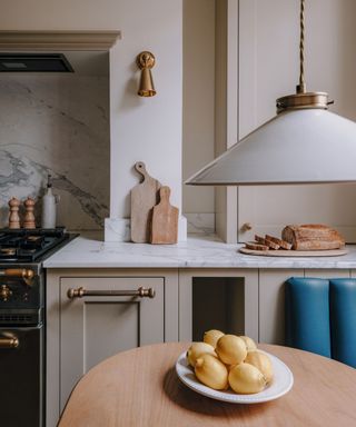 kitchen with marble countertops and beige cabinets