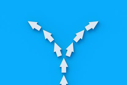 a line of white arrow splitting into two directions with a bright blue background