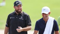 Shane Lowry with Rory McIlroy's caddie Harry Diamond