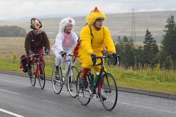 Some interestingly attired fans ride up Shap Fell to watch stage 4 of the Tour of Britain.