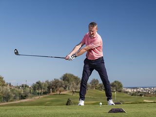 Anders Mankert halfway through the backswing, maintaining width throughout