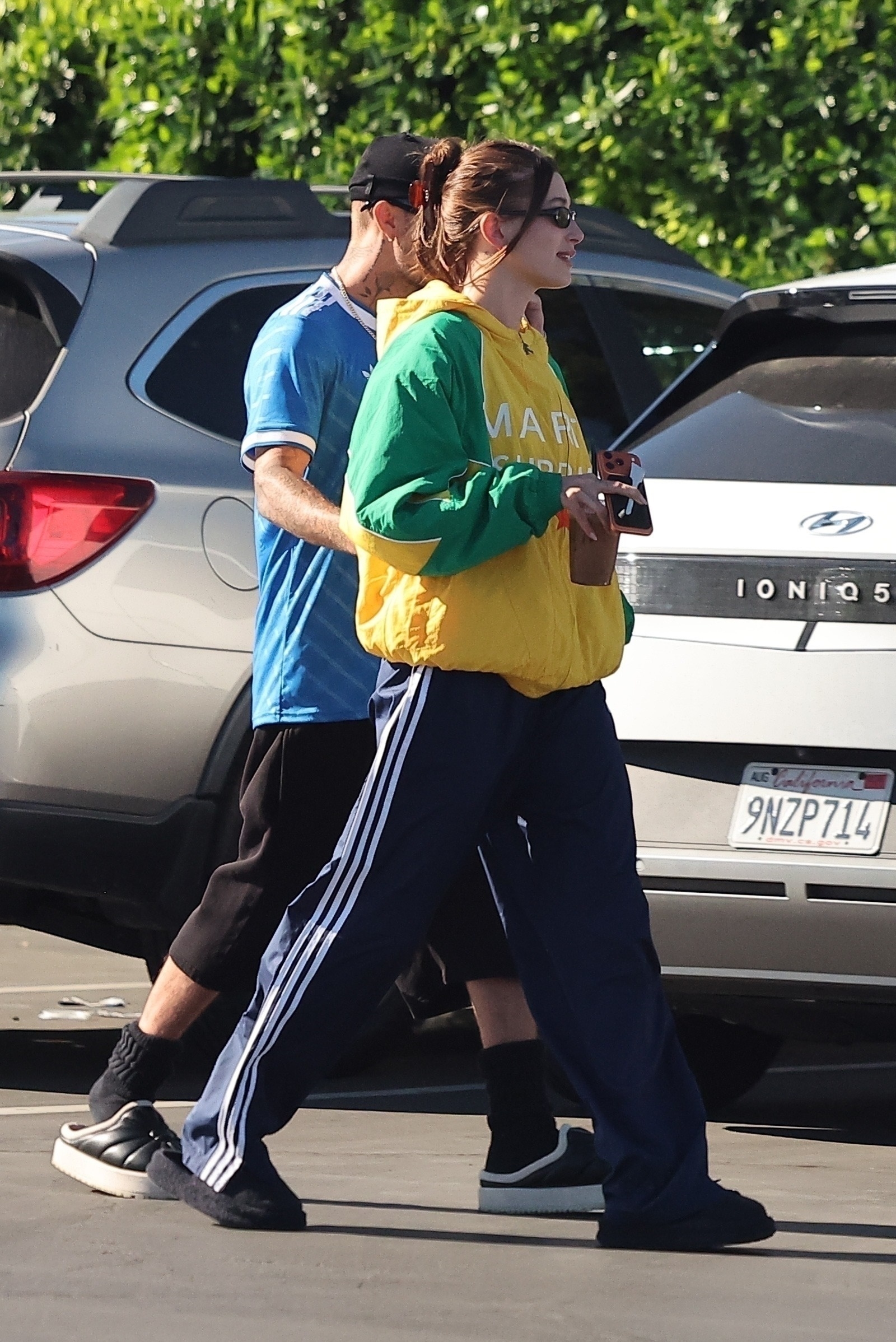 Justin and Hailey Bieber enjoy a relaxed outing at Vintage Coffee in Palm Springs, taking time to greet fans and pose for photos as they walk to their car. Justin wore a Real Madrid 2025/26 third kit while Hailey wore a green and yellow Marty Supreme Dream Big Jacket as Timothee Chalamet gears up for his role in new Josh Safdie film.