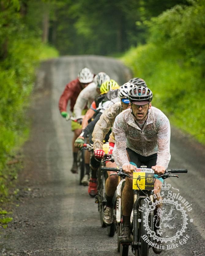 Michael Wissell takes the lead as the leaders follow on the gravel climb.
