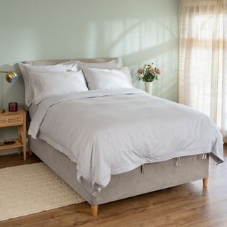 White bedding in a neutral bedroom