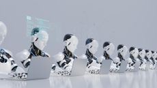Automation concept image showing a row of robots working on laptops.