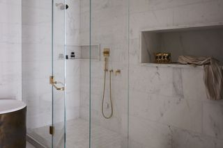 A bathroom shower with niches