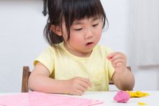 a young asian girl at school.