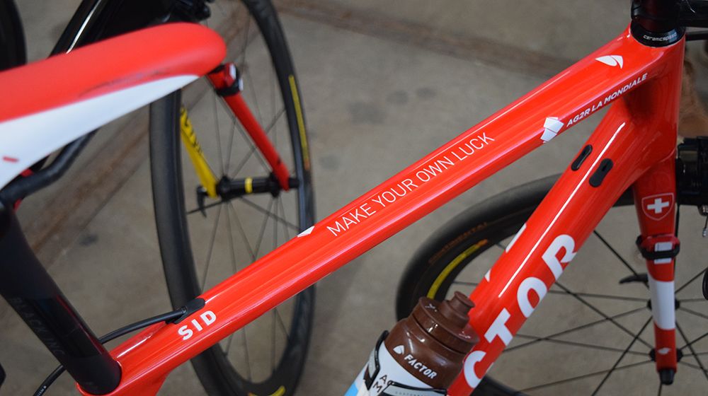 Silvain Dillier and Oliver Naesen who both have custom national champion paint jobs have mottos adorning their top tube