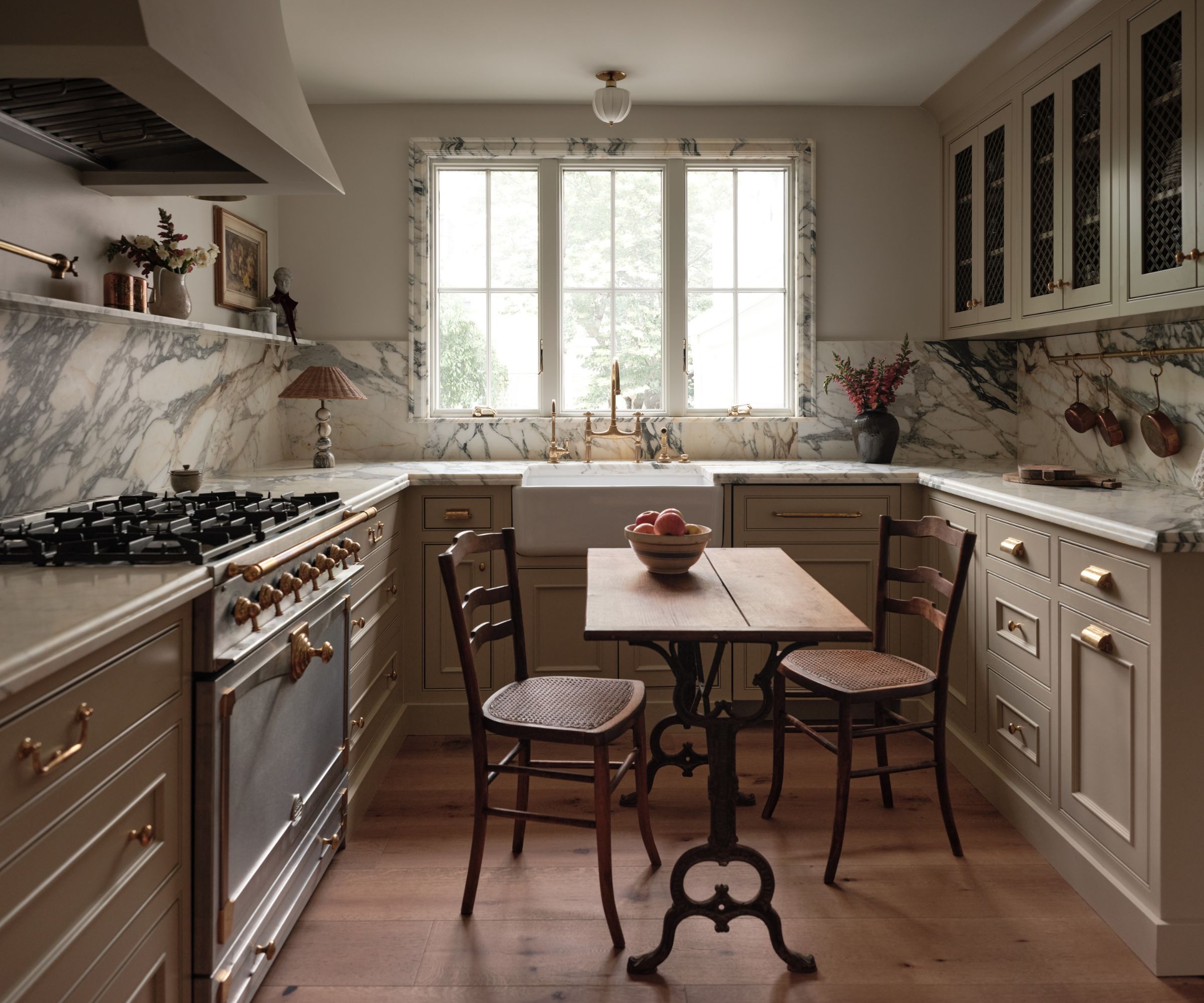 A small kitchen with marble window trim