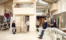 A photo of Giacomo Moor, front right, at his workshop in north-east Milan with members of his team and his new shelving for Acerbis. Pictured left to right: Dario Passi, product designer; Alessandra Gatti, interior designer; Gionata Dellaca, production manager; Andrea Galbiati, production and assembly; Moor; Carlo Mastrangelo, production; Aurelie Callegari, studio manager
