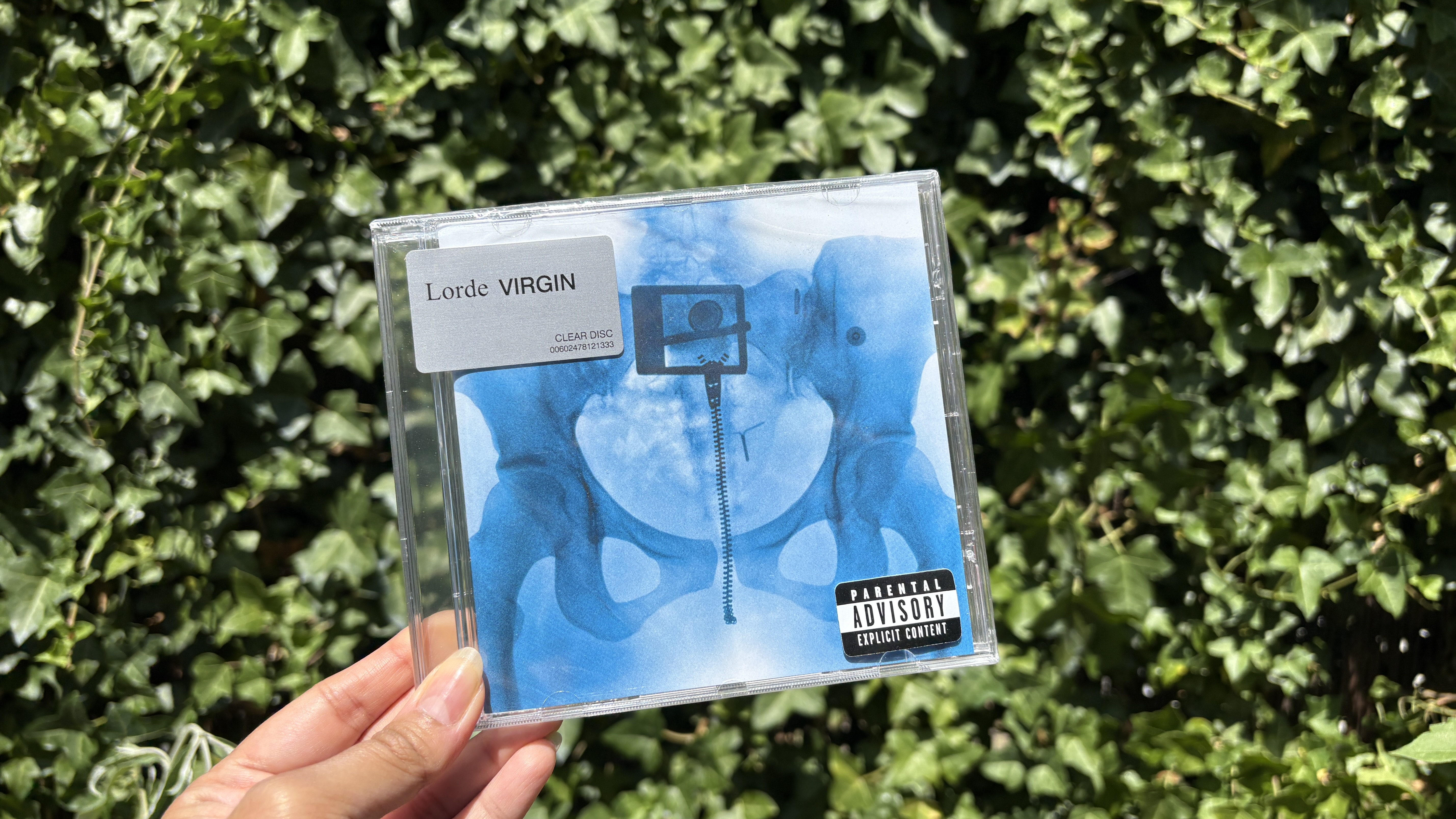 Lorde transparent CD held in hand