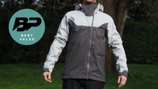 Man in cycling jacket under tree