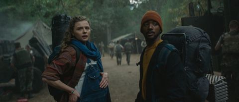 Chloë Moretz-Grace and Algee Smith standing in the middle of a camp in Mother/Android.
