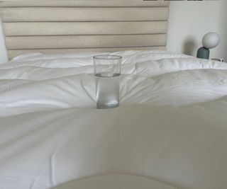 M&S Comfortably Cool Mattress Topper with a glass of water