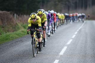 The pack of riders cycles during the 4th stage of the Paris-Nice cycling race, 163,4 km between Vichy and La Loge des Gardes, on March 12, 2025. (Photo by Anne-Christine POUJOULAT / AFP)