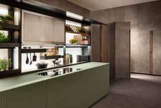 a modern home with a green kitchen and backsplash storage