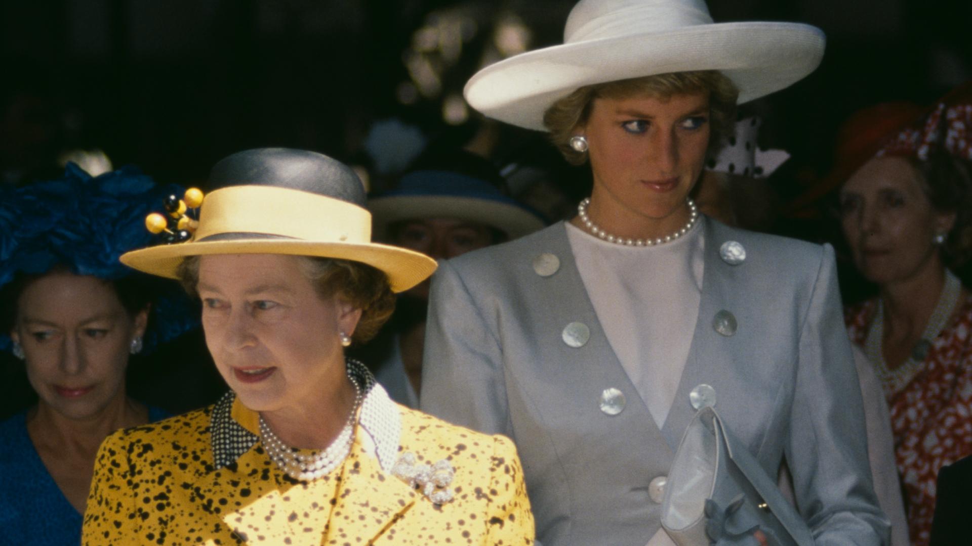 Queen Elizabeth II and Princess Diana attending a wedding on July 30, 1988