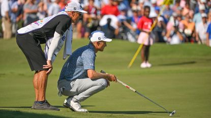 Will Zalatoris and his caddie size up a putt at the FedEx St Jude Championship